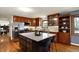 Spacious eat-in kitchen with center island, granite counters and stainless steel appliances at 7728 Mallard Way, Indianapolis, IN 46256