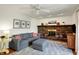 Comfortable living room boasts a brick fireplace and neutral decor at 7728 Mallard Way, Indianapolis, IN 46256