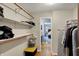 Spacious walk-in closet with shelving, storage, and a view into an adjoining bedroom at 7728 Mallard Way, Indianapolis, IN 46256