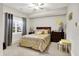 Bedroom with ceiling fan features large windows, carpeted floors, and neutral paint at 8089 Lynch Ln, Indianapolis, IN 46250