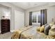 Bedroom with gray window curtains and carpeted flooring is well lit with natural light at 8089 Lynch Ln, Indianapolis, IN 46250