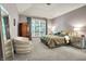 Calm bedroom features a large window and warm, neutral tones at 8089 Lynch Ln, Indianapolis, IN 46250