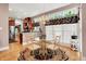 Bright dining area adjacent to the kitchen has hardwood floors, a glass-topped table and lots of natural light at 8089 Lynch Ln, Indianapolis, IN 46250