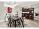 Finished basement features dining area with wet bar, black and white stripped chairs and decor at 8089 Lynch Ln, Indianapolis, IN 46250
