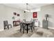 The dining area offers a dark table with striped chairs, and a view into the Gathering room at 8089 Lynch Ln, Indianapolis, IN 46250
