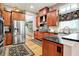 Spacious kitchen with stainless steel fridge, hardwood floors and beautiful, patterned dark rug at 8089 Lynch Ln, Indianapolis, IN 46250