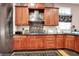 Updated kitchen with stainless steel appliances, a decorative backsplash and hardwood floors at 8089 Lynch Ln, Indianapolis, IN 46250