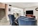 Cozy living room with blue armchairs and view into the dining area at 8089 Lynch Ln, Indianapolis, IN 46250