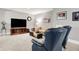 Comfortable living room with a tan sofa and blue armchairs at 8089 Lynch Ln, Indianapolis, IN 46250