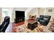 Inviting living room with a large screen TV, comfortable seating, and hardwood floors offers space to relax and entertain at 8089 Lynch Ln, Indianapolis, IN 46250