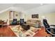 Cozy living room boasts hardwood floors, a comfortable sofa, armchairs, and recessed lighting creating a relaxing atmosphere at 8089 Lynch Ln, Indianapolis, IN 46250