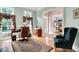 Comfortable home office with hardwood floors, built-in cabinets, and large windows overlooking the yard at 8089 Lynch Ln, Indianapolis, IN 46250