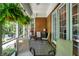 Relaxing screened-in porch with brick accent wall and patterned rug at 8089 Lynch Ln, Indianapolis, IN 46250