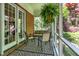 Inviting screened porch with comfortable seating, brick accents, and outdoor views at 8089 Lynch Ln, Indianapolis, IN 46250
