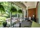 Comfortable screened porch with outdoor furniture offering garden views at 8089 Lynch Ln, Indianapolis, IN 46250