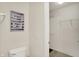 Well-lit bathroom featuring a toilet next to a closet with wire shelving at 8116 Barksdale Way, Indianapolis, IN 46216