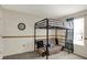 Bedroom with a unique loft bed setup, featuring string lights and cozy seating at 8116 Barksdale Way, Indianapolis, IN 46216