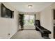 Bonus room with a window for natural light, carpeting, a dart board and a skeeball machine at 8116 Barksdale Way, Indianapolis, IN 46216
