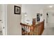 Well-lit hallway with a view of a bedroom featuring carpeted floors and neutral-toned walls at 8116 Barksdale Way, Indianapolis, IN 46216