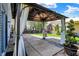 Backyard patio featuring a covered gazebo with curtains, plus lawn and garden views at 8116 Barksdale Way, Indianapolis, IN 46216