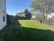 Spacious fenced backyard featuring a lush green lawn and mature trees for shade and privacy at 82 Pin Oak Ct, Whiteland, IN 46184