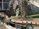 Backyard with a statue of an angel, pond and landscaping in a shady setting at 82 Pin Oak Ct, Whiteland, IN 46184