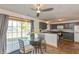 Eat-in kitchen features dark cabinets, stainless steel appliances, and sliding door to patio at 82 Pin Oak Ct, Whiteland, IN 46184