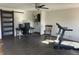 Spacious room with a ceiling fan, exercise equipment, and a desk area for work or study at 82 Pin Oak Ct, Whiteland, IN 46184