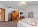 Spacious bedroom with vaulted ceiling, carpet flooring, and view of attached bathroom at 82 Pin Oak Ct, Whiteland, IN 46184
