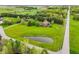 Drone shot of home with large yard, long driveway, surrounded by green space and mature trees at 8362 N County Road 650 E, Brownsburg, IN 46112