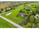 Aerial view of the estate features a pond, long driveway, mature trees, and well-kept lawn at 8362 N County Road 650 E, Brownsburg, IN 46112