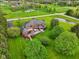 Spacious yard showcasing beautiful landscaping and a serene pond, creating a peaceful environment at 8362 N County Road 650 E, Brownsburg, IN 46112