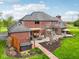 Expansive backyard featuring a patio with outdoor seating and a secluded hot tub area at 8362 N County Road 650 E, Brownsburg, IN 46112