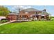 Lush backyard featuring a patio with an inviting pergola, comfortable seating, and well-manicured landscaping at 8362 N County Road 650 E, Brownsburg, IN 46112