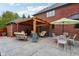 Charming backyard patio featuring a pergola, comfortable seating, and dining areas, perfect for outdoor entertaining at 8362 N County Road 650 E, Brownsburg, IN 46112