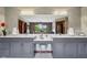 This modern bathroom features a double vanity, makeup counter, and large mirror at 8362 N County Road 650 E, Brownsburg, IN 46112