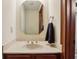 Bathroom with beige countertop, dark wood cabinets, and vanity mirror at 8362 N County Road 650 E, Brownsburg, IN 46112