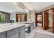 Modern bathroom featuring a double vanity, makeup counter, and doorway at 8362 N County Road 650 E, Brownsburg, IN 46112