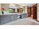Bathroom with a double vanity, makeup counter, rug and an open door at 8362 N County Road 650 E, Brownsburg, IN 46112