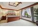 Spacious main bedroom with tray ceiling, wood trim, large windows, and a comfortable king-size bed at 8362 N County Road 650 E, Brownsburg, IN 46112