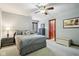 Relaxing bedroom with neutral tones, ceiling fan, and window offering natural light at 8362 N County Road 650 E, Brownsburg, IN 46112