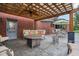 Relaxing covered patio area featuring comfortable seating, a ceiling fan, and convenient access to the house at 8362 N County Road 650 E, Brownsburg, IN 46112