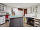 Large craft room featuring wood floors, an island, white cabinets, sewing machines, and neutral walls at 8362 N County Road 650 E, Brownsburg, IN 46112