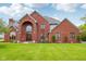 Attractive brick home with a well-manicured lawn, arched entry, and neatly trimmed landscaping at 8362 N County Road 650 E, Brownsburg, IN 46112