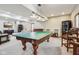 Recreation room featuring pool table, wet bar, stylish chairs, recessed lights, and neutral walls and carpet at 8362 N County Road 650 E, Brownsburg, IN 46112
