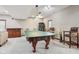 Recreation room featuring pool table, wet bar, stylish chairs, recessed lights, and neutral walls and carpet at 8362 N County Road 650 E, Brownsburg, IN 46112