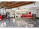 Spacious garage area with epoxy flooring, wooden ceiling, and tool storage with racing decals at 8362 N County Road 650 E, Brownsburg, IN 46112