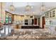 Elegant kitchen features granite counters, stainless steel appliances, and decorative pendant lighting at 8362 N County Road 650 E, Brownsburg, IN 46112