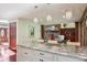 Bright kitchen with granite countertops, large island and view to living room with fireplace at 8362 N County Road 650 E, Brownsburg, IN 46112