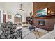 Cozy living room with a brick fireplace, vaulted ceilings, and stylish furnishings at 8362 N County Road 650 E, Brownsburg, IN 46112